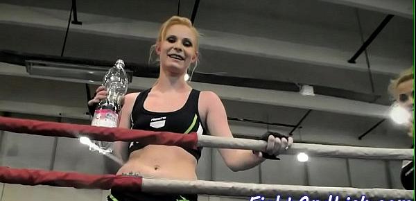  Muscular women wrestling in a boxing ring